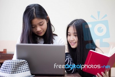 Two Asia Thai High School Student Uniform Best Friends Beautiful Girl Using Her Laptop Stock Photo