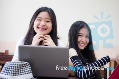 Two Asia Thai High School Student Uniform Best Friends Beautiful Girl Using Her Laptop Stock Photo