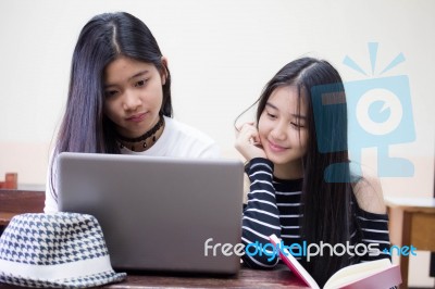 Two Asia Thai High School Student Uniform Best Friends Beautiful Girl Using Her Laptop Stock Photo