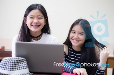 Two Asia Thai High School Student Uniform Best Friends Beautiful Girl Using Her Laptop Stock Photo