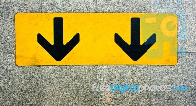 Two Black Arrow On Yellow Plate Stock Photo