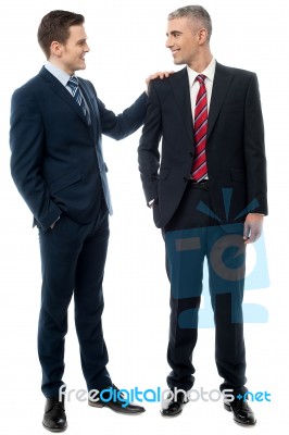 Two Business Partners Talking Together Stock Photo