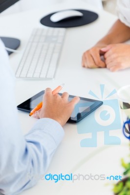 Two Business Woman Working In Office With Digital Tablet Stock Photo