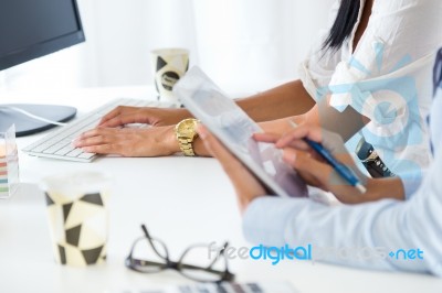 Two Business Woman Working In Office With Digital Tablet Stock Photo