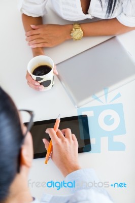 Two Business Woman Working In Office With Digital Tablet Stock Photo