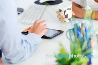 Two Business Woman Working In Office With Digital Tablet Stock Photo