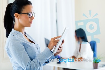 Two Business Woman Working In Office With Digital Tablet Stock Photo