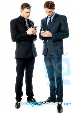 Two Businessmen Using The Phone Stock Photo