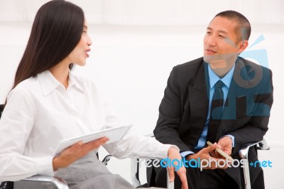 Two Businesspeople In Meeting Stock Photo