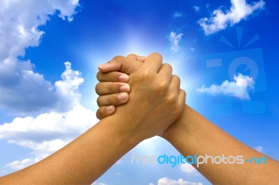 Two Coupled Hands, On Sky Stock Image