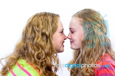 Two Dutch Teenage Girls Noses Make Contact Stock Photo