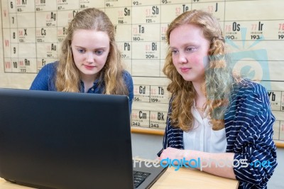 Two Dutch Teenage Girls Working At Computer In Chemistry Lesson Stock Photo