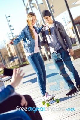 Two Friends Having Fun With Skate Stock Photo