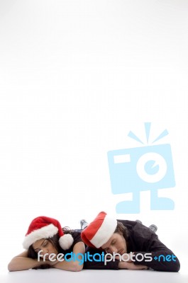 Two Friends Lying On The Floor In Christmas Hat Stock Photo