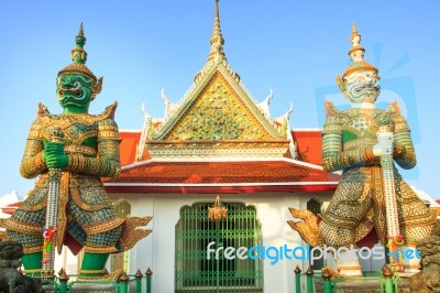 Two Giant In Front Of Wat Arun Temple Most Important Landmark Of… Stock Photo