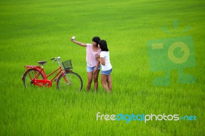 Two Girls Taking Photo Stock Photo