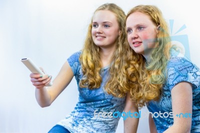 Two Girls Watching Tv Stock Photo