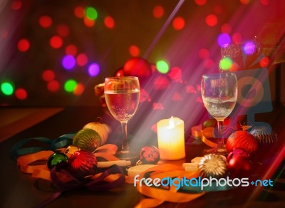 Two Glasses Of Champagne With A Christmas Decor In The Background Stock Photo