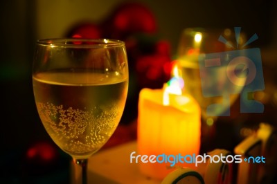 Two Glasses Of Champagne With A Christmas Decor In The Background Stock Photo