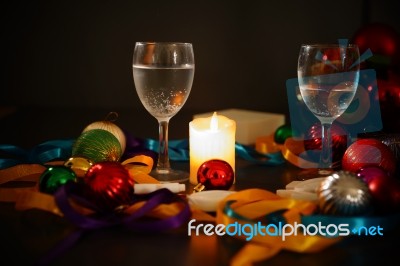 Two Glasses Of Champagne With A Christmas Decor In The Background Stock Photo