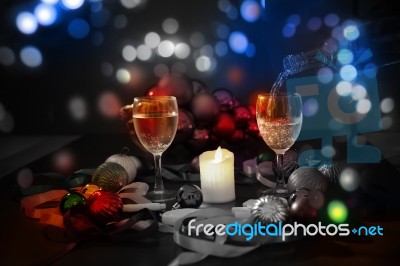 Two Glasses Of Champagne With A Christmas Decor In The Background Stock Photo