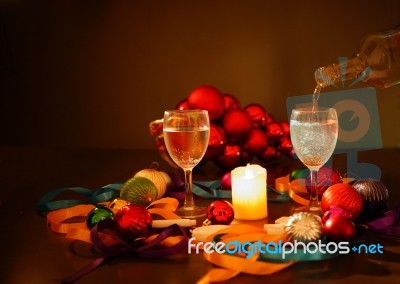 Two Glasses Of Champagne With A Christmas Decor In The Background Stock Photo