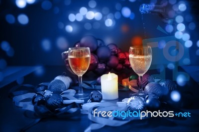 Two Glasses Of Champagne With A Christmas Decor In The Background Stock Photo