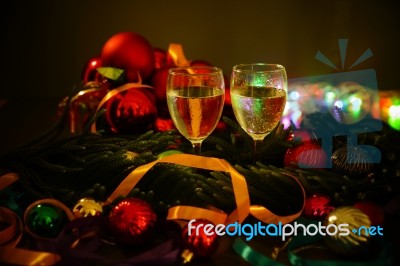 Two Glasses Of Champagne With A Christmas Decor In The Background Stock Photo