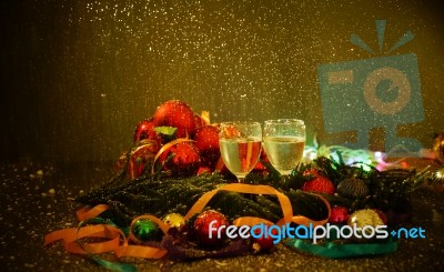 Two Glasses Of Champagne With A Christmas Decor In The Background Stock Photo