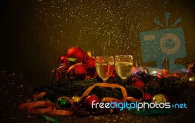 Two Glasses Of Champagne With A Christmas Decor In The Background Stock Photo