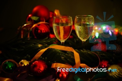 Two Glasses Of Champagne With A Christmas Decor In The Background Stock Photo