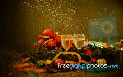 Two Glasses Of Champagne With A Christmas Decor In The Background Stock Photo