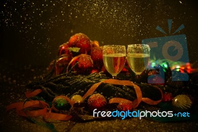 Two Glasses Of Champagne With A Christmas Decor In The Background Stock Photo