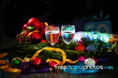 Two Glasses Of Champagne With A Christmas Decor In The Background Stock Photo