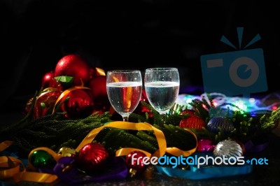 Two Glasses Of Champagne With A Christmas Decor In The Background Stock Photo