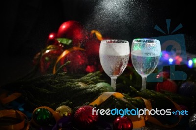 Two Glasses Of Champagne With A Christmas Decor In The Background Stock Photo