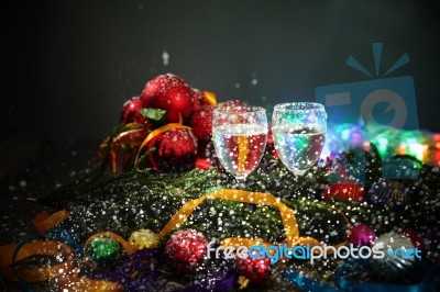 Two Glasses Of Champagne With A Christmas Decor In The Background Stock Photo