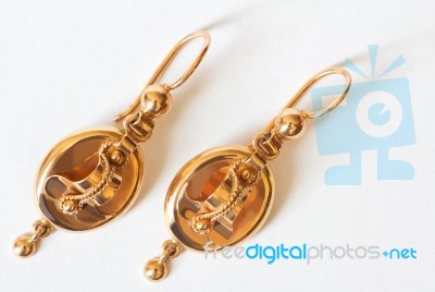 Two Golden Earrings Stock Photo