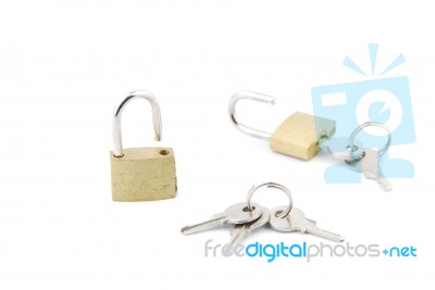 Two Golden Open Padlock With Keys On White Stock Photo