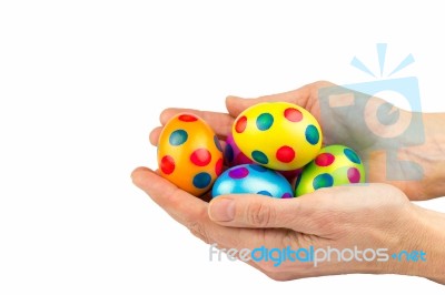 Two Hands Holding  Painted Easter Eggs Isolated On White Backgro… Stock Photo