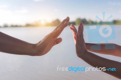 Two Hands Holding Puzzle Stock Photo