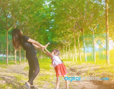 Two Hands Holding Puzzle Mother And Child,the Woman And Child Holding Hands At Sunset Stock Photo