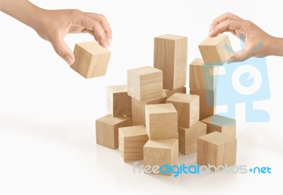 Two Hands Playing Wooden Box On Isolated Background Stock Photo