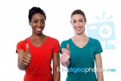 Two Happy Women With Thumbs Up Stock Photo