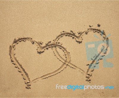 Two Hearts On Sandy Beach Stock Photo