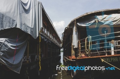 Two House Boats Docked Next To Each Other Stock Photo