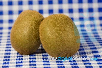 Two Kiwis On The Table Stock Photo