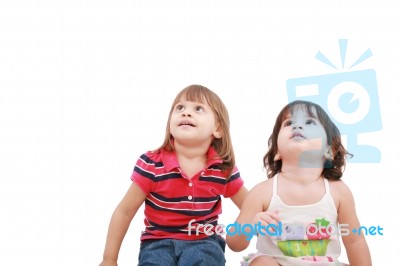 Two Little Girls Looking Up Stock Photo