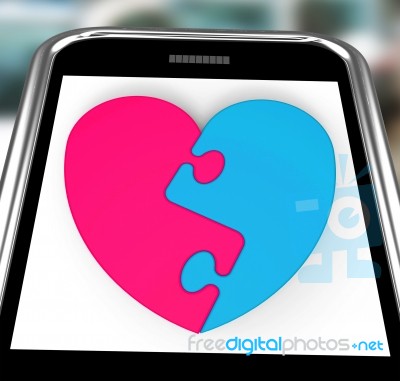 Two-pieced Heart On Smartphone Showing Complement Stock Image