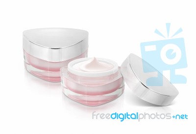 Two Pink Triangle Cosmetic Jar On White Background Stock Photo